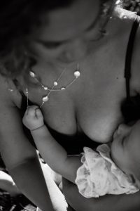 Mom looking down at breastfeeding baby